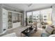 Bright living room with built-in shelves and access to the balcony at 100 Central Ave # C619, Sarasota, FL 34236