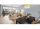 Bright living room with modern furniture, neutral tones, and access to a balcony at 100 Central Ave # C619, Sarasota, FL 34236