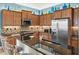 Close up of kitchen featuring granite countertops and stainless steel appliances at 10412 Crooked Creek Dr, Venice, FL 34293
