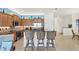 Charming kitchen with wooden cabinets, granite countertops, and stainless steel appliances at 10412 Crooked Creek Dr, Venice, FL 34293