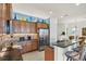 Kitchen featuring stainless steel refrigerator and granite countertops with barstool seating at 10412 Crooked Creek Dr, Venice, FL 34293