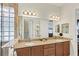 Large main bathroom features dual sinks, granite countertops, and lots of cabinet space at 10412 Crooked Creek Dr, Venice, FL 34293