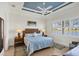 Serene main bedroom with stylish decor and a view of the lake at 10412 Crooked Creek Dr, Venice, FL 34293