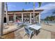 Inviting outdoor seating area near the pool, ideal for dining and socializing at 10412 Crooked Creek Dr, Venice, FL 34293