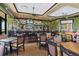 Welcoming restaurant interior with a stylish bar area and comfortable seating arrangements at 10412 Crooked Creek Dr, Venice, FL 34293