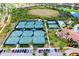 Aerial view of multiple outdoor tennis courts and community parking at 10742 Ironbridge Dr, Venice, FL 34293