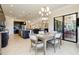 Open floor plan includes a dining area with views of kitchen and lanai at 10742 Ironbridge Dr, Venice, FL 34293