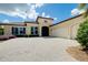 Attractive home featuring a tiled roof, a paver driveway, and a two-car garage at 10742 Ironbridge Dr, Venice, FL 34293