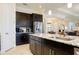 Kitchen featuring dark cabinets, stainless steel appliances, and granite countertops at 10742 Ironbridge Dr, Venice, FL 34293