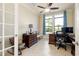 Bright office space features neutral walls, dual windows with privacy shades and traditional furnishings at 10742 Ironbridge Dr, Venice, FL 34293