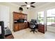 Well-appointed home office with built-in cabinetry and desk space at 10742 Ironbridge Dr, Venice, FL 34293