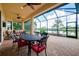 Outdoor patio with brick flooring, a view of the lake, ceiling fans, and a screen to keep the bugs away at 10742 Ironbridge Dr, Venice, FL 34293