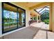 A covered patio with brick pavers and a view of the water at 10742 Ironbridge Dr, Venice, FL 34293