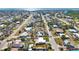 Aerial view displays this neighborhood, it's streets, and the bay in the distance at 1075 Falcon Rd, Venice, FL 34293