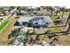 Aerial view of home featuring a well-manicured lawn, and driveway at 1075 Falcon Rd, Venice, FL 34293