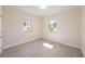 Bedroom features two windows and wood-look floors at 1075 Falcon Rd, Venice, FL 34293