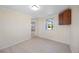 Bedroom with wood-look floors, a window and a door at 1075 Falcon Rd, Venice, FL 34293