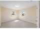 Bedroom with natural light, light walls, and wood-look floors at 1075 Falcon Rd, Venice, FL 34293
