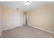 Bedroom with neutral paint, wood-look floors and a closet at 1075 Falcon Rd, Venice, FL 34293
