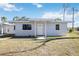 Charming single-story home featuring a well-maintained lawn and a welcoming front entrance at 1075 Falcon Rd, Venice, FL 34293