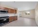 Bright kitchen features stainless steel appliances, wood cabinets, and white subway tile backsplash at 1075 Falcon Rd, Venice, FL 34293