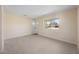 Bright living room boasts beautiful light-colored floors and a refreshing view from the windows at 1075 Falcon Rd, Venice, FL 34293