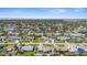 An aerial view of a charming single-Gathering home with an ocean view, nestled in a sunny residential neighborhood at 1087 Piedmont Rd, Venice, FL 34293