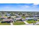 Aerial view of lovely home in a beautiful community with green lawns and stunning landscaping at 1087 Piedmont Rd, Venice, FL 34293