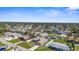 Charming home in a pleasant community with green lawns and stunning landscaping viewed from above at 1087 Piedmont Rd, Venice, FL 34293