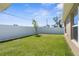 Well-maintained backyard with white fence and grass at 1087 Piedmont Rd, Venice, FL 34293