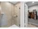 Modern bathroom features a glass-enclosed shower and walk-in closet at 1087 Piedmont Rd, Venice, FL 34293