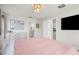 Spacious bedroom with ensuite bath, TV, and dresser at 1087 Piedmont Rd, Venice, FL 34293
