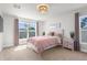 Cozy bedroom with large windows, neutral carpet, and ample natural light at 1087 Piedmont Rd, Venice, FL 34293