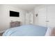 Bedroom featuring a television, dresser, and ample closet space at 1087 Piedmont Rd, Venice, FL 34293