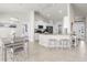 Bright open kitchen features white cabinets, stainless appliances, and granite countertops, perfect for cooking and entertaining at 1087 Piedmont Rd, Venice, FL 34293