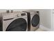 Laundry room with front-load washer and dryer at 1087 Piedmont Rd, Venice, FL 34293