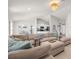 Open floor plan featuring a spacious living room, kitchen, and dining area with bright natural light and modern design at 1087 Piedmont Rd, Venice, FL 34293