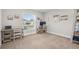 Home office with two desks, bright windows, and coastal artwork at 1087 Piedmont Rd, Venice, FL 34293
