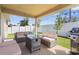 A covered patio with comfortable seating and a grill, perfect for outdoor gatherings and relaxation at 1087 Piedmont Rd, Venice, FL 34293