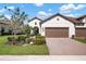 Beautiful single-story home with a well-manicured lawn and lush landscaping at 11172 Mc Dermott Ct, Englewood, FL 34223