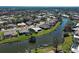Waterfront home situated on a peaceful lake, featuring lush landscaping and a private backyard oasis at 1125 Deardon Dr, Venice, FL 34292