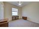 Spacious bedroom with a ceiling fan, and a window, offering comfort and natural light at 1125 Deardon Dr, Venice, FL 34292