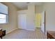 Bedroom featuring a closet, a window, and neutral paint, creating a serene atmosphere at 1125 Deardon Dr, Venice, FL 34292