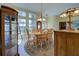 Cozy dining room with traditional table set and hardwood floors at 1125 Deardon Dr, Venice, FL 34292