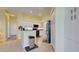 Well-lit kitchen featuring white cabinets, stainless steel appliances, and granite countertops at 1125 Deardon Dr, Venice, FL 34292