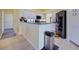 Clean kitchen with granite countertops, stainless appliances, and white cabinets at 1125 Deardon Dr, Venice, FL 34292