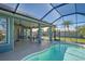 Expansive lanai featuring an outdoor dining area, pool, and views of the backyard at 1125 Deardon Dr, Venice, FL 34292