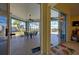 Covered lanai featuring ceiling fans, a dining table, and views of the manicured backyard at 1125 Deardon Dr, Venice, FL 34292
