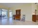 Bright living room with wood floors and a classic secretary desk at 1125 Deardon Dr, Venice, FL 34292