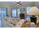 Cozy living room with screened lanai access and comfortable furnishings at 1125 Deardon Dr, Venice, FL 34292